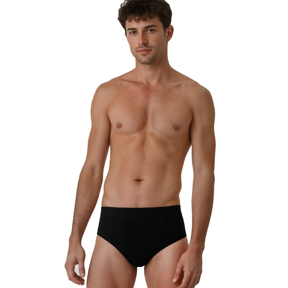 Mann in schwarzen Merino Slip Herren 150 g/m2, ideal für Sport und Outdoor-Aktivitäten, mit innovativer Corespun Merinowolle für Komfort und Haltbarkeit.